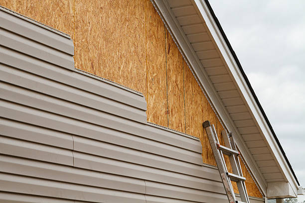 Professional Siding Contractor technician working in Dupont, PA